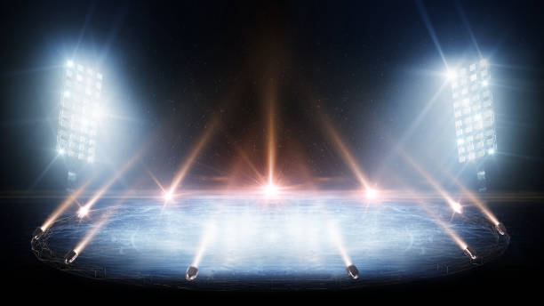 istock Background. Spotlight shines on the rink. Bright lighting with spotlights. Beautiful empty winter background and empty ice rink with lights. Isolated in black 2191345901