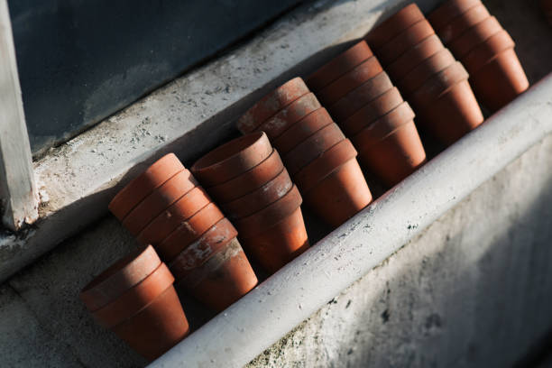 terracotta plant potting pots stacked and lined up in a row in Stockholm, Stockholm County, Sweden