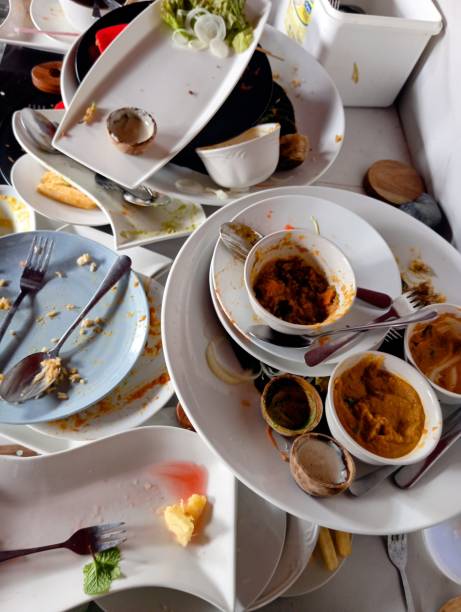 pile of dirty dishes before being washed in the kitchen