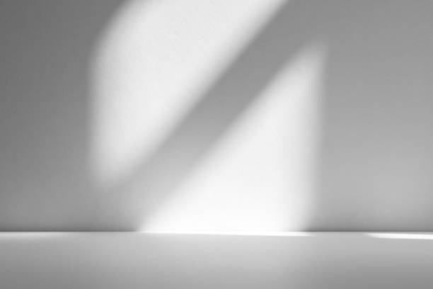istock Wall interior background, studio and backdrops show products.with shadow from window color white . background for text insertion and presentation product 2191350987