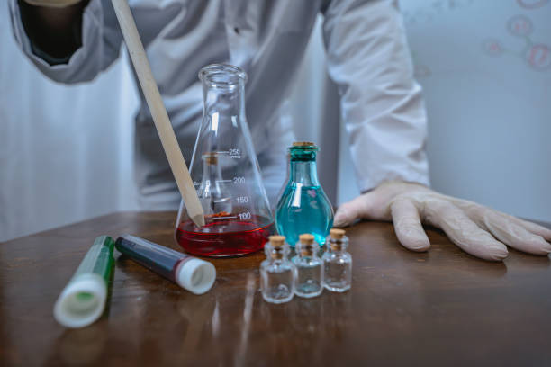 istock Scientist working with test tubes and colorful liquids in laboratory 2191351255