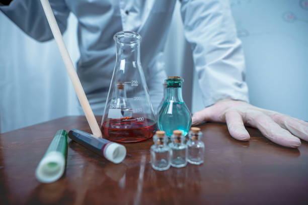 istock Scientist working with test tubes and colorful liquids in laboratory 2191351256