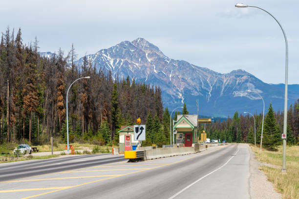 Icefields Parkway (Alberta Highway 93) toll to the town of Jasper. Pyramid Mountain in the background. Jasper, Alberta, Canada.