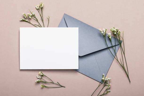istock Gray envelope with flowers on a brown background. Postcard, layout. 2191353235