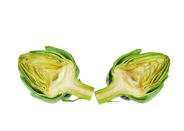 fresh green artichoke cut in half isolated on a white background.