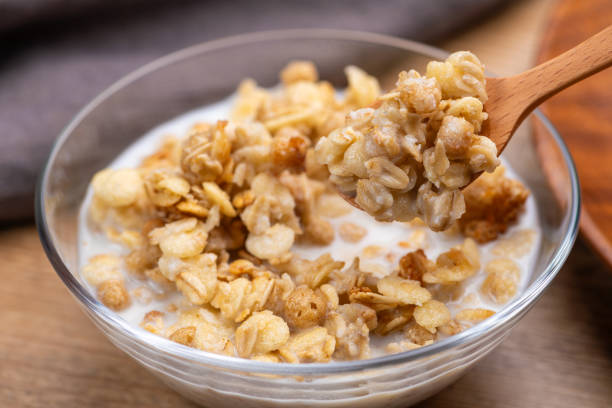 istock Pouring Milk Over Granola for Breakfast 2191358276
