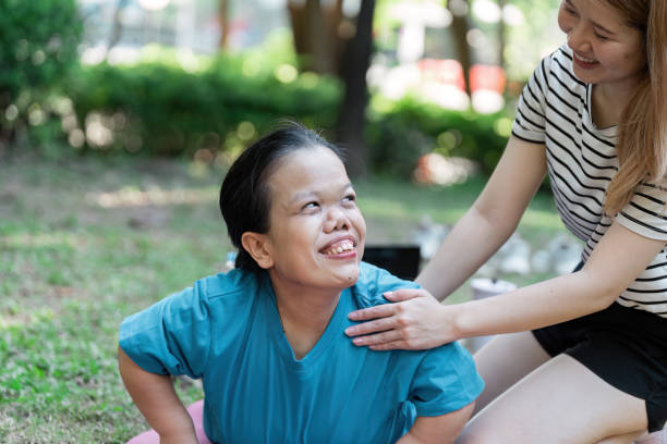 istock Joyful Interaction Between Diverse Individuals in a Park Setting Highlighting Inclusion and Friendship 2191358424