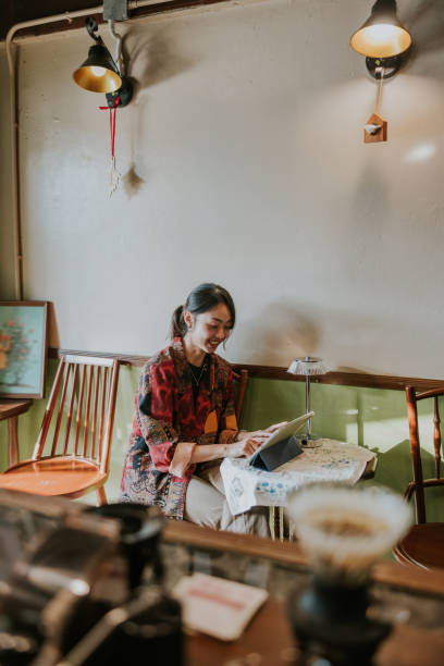 istock Happiness Asian Freelancer woman is working in the coffeeshop while using iPad. 2191359480