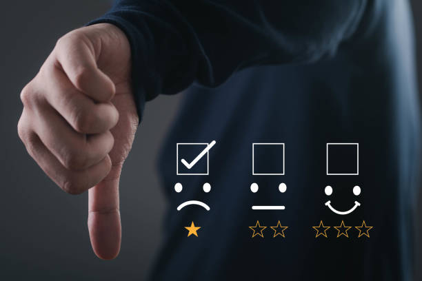 istock A hand gestures a thumbs down with rating icons, symbolizing negative feedback or dissatisfaction in a review. 2191364583