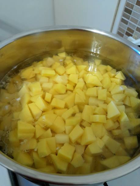 istock Diced potatoes in a pot of water 2191364949