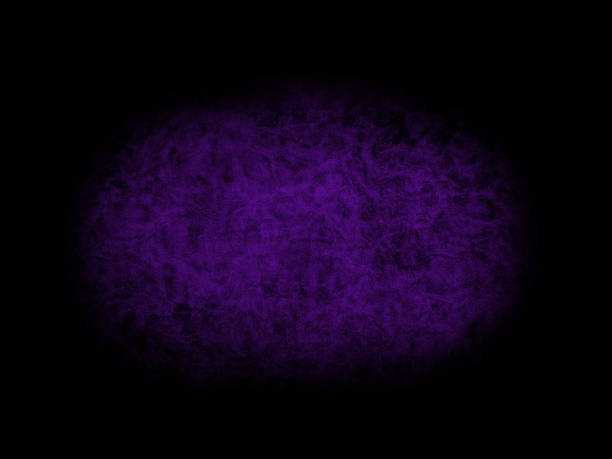 Dark purple leather upholstery and black background, isolated on a black background