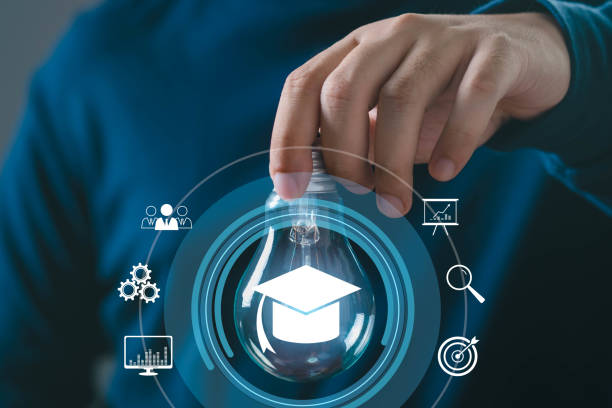 istock A hand holding a light bulb symbolizing educational ideas and creativity, surrounded by digital icons of learning and innovation. 2191370783