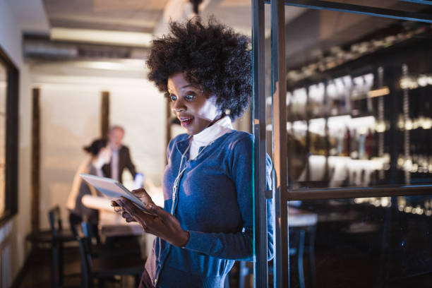 istock Joyful Woman in Modern office with Wine Bar 2191371877