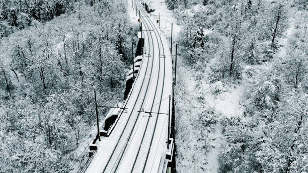 istock Snowy Railway Through Winter Forest Landscape 2191372092