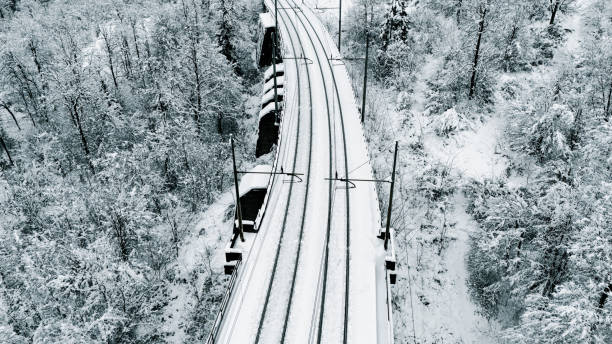 istock Snow-Covered Railway Tracks Through a Winter Forest 2191372094