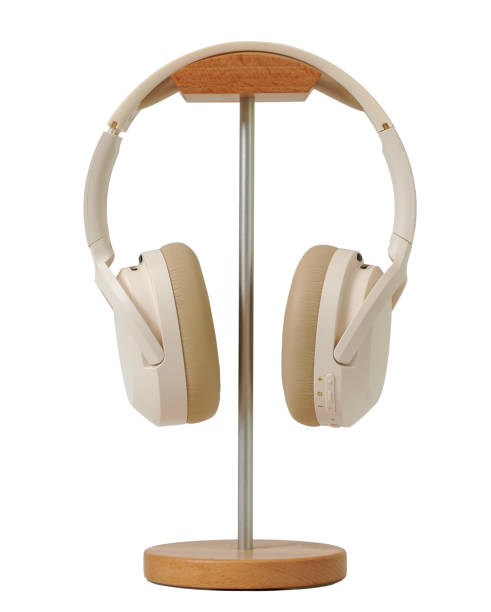 istock Minimal style white wireless headphone on wooden stand isolated on white background with clipping path 2191372597