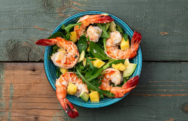 istock Salad with tiger shrimps , avocado and mango . Top view 2191373265