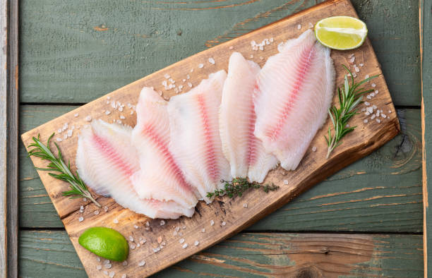 istock Raw tilapia fillet photography . Top view 2191373350