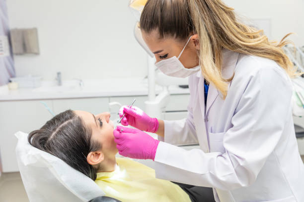 istock Young woman having routine check-ups at the dentist. A modern dental office. 2191374446