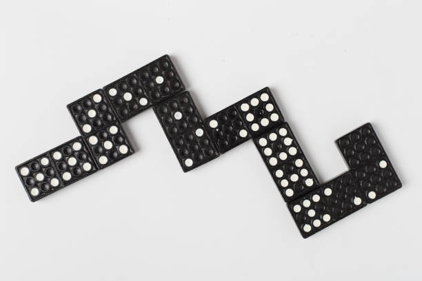 istock Black domino tiles on white background, top view 2191376695