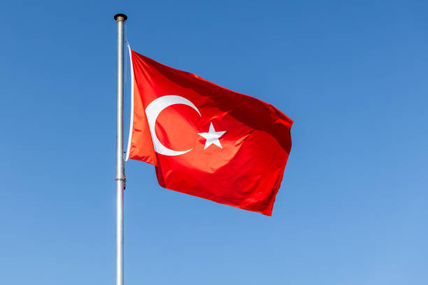 istock Flag of Turkey is under clear blue sky 2191377698