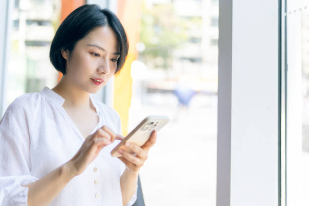 istock oung woman using mobile phone in cafe 2191378849