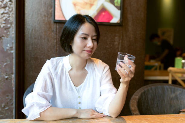Woman enjoying cappuccino in a cafe