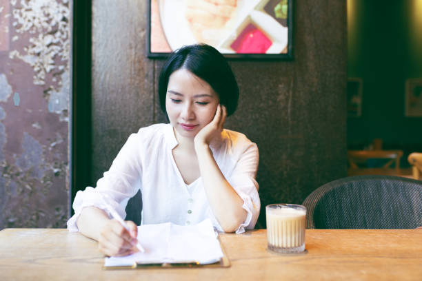 istock Young woman working at a cafe 2191378936