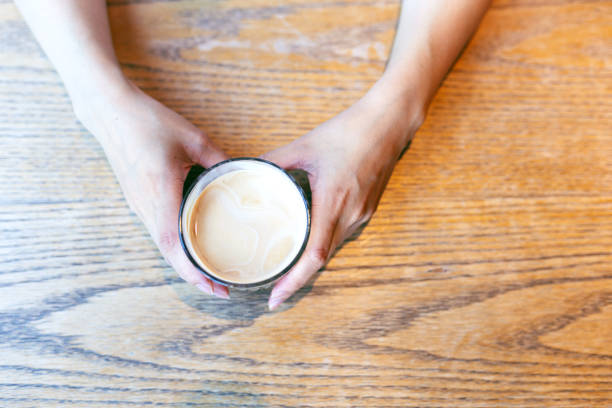 istock Woman hands holding cup of coffee 2191378971