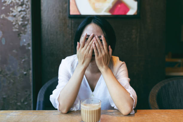 istock Woman enjoying cappuccino in a cafe 2191379006