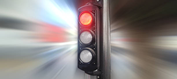 istock Red traffic light showing stop signal with blurred background 2191380155