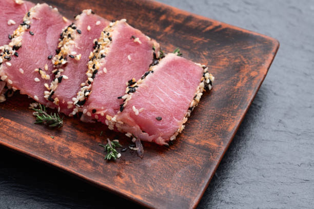 istock Sliced tuna steak with sesame photography . Top view 2191380393