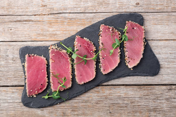 istock Sliced tuna steak with sesame photography . Top view 2191380397
