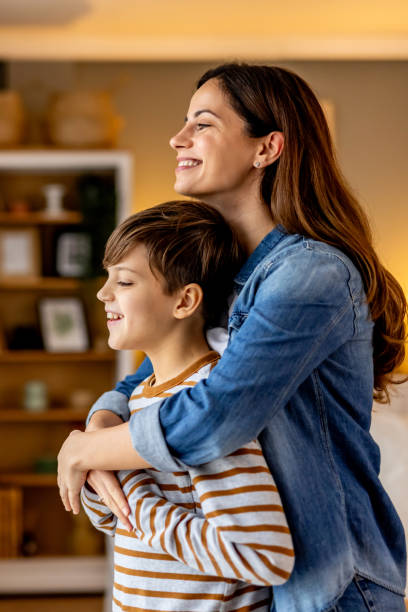 Mother Hugging Her Son in a Warm Home Environment
