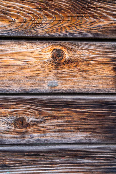 Dark boards with knots as a background for graphics.
