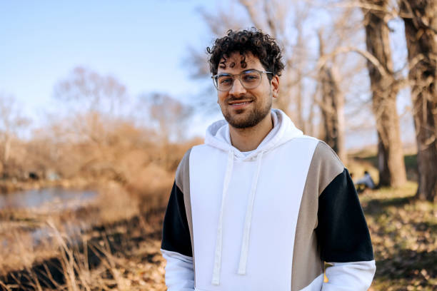 istock Smiling young man posing for camera while enjoying sunny day in nature 2191382362