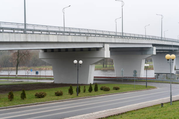 istock Cityscape. Automobile bridge over the road and the river 2191384647