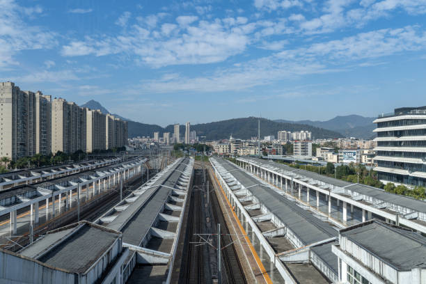 istock Under the blue sky and white clouds, the empty train tracks in the train station 2191385812