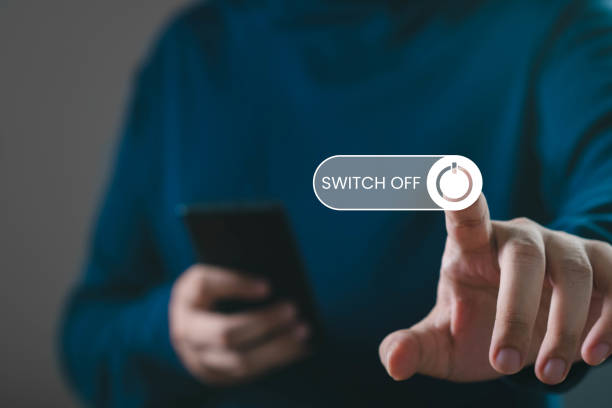 istock A person turning off a device with a 'Switch Off' button, showcasing modern technology interaction and digital lifestyle. 2191385857