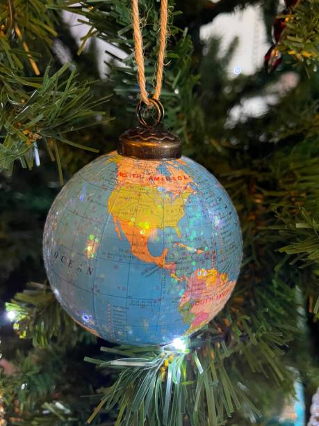 istock Globe bauble on tree with Americas and Pacific Ocean 2191387003