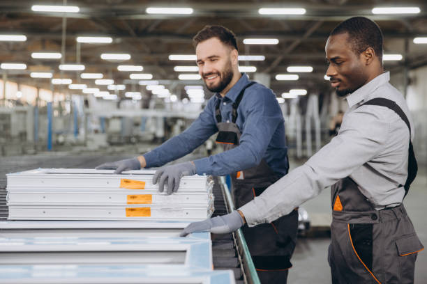 istock Factory workers producing PVC windows and doors checking quality on production line 2191387208