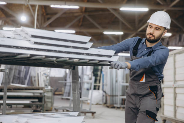istock Factory worker moving aluminum profiles for windows and doors production 2191387377