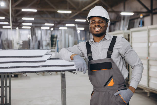 istock Factory worker posing near aluminum profiles for windows and doors production 2191387425