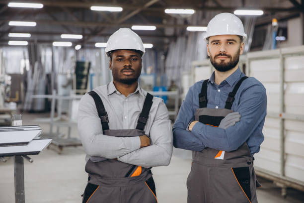 istock Engineers standing with arms crossed in PVC windows and doors factory 2191387483