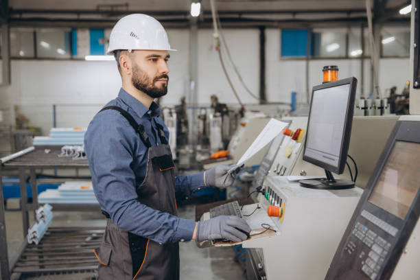 istock Factory worker operating machinery for aluminum and pvc windows and doors production 2191387517