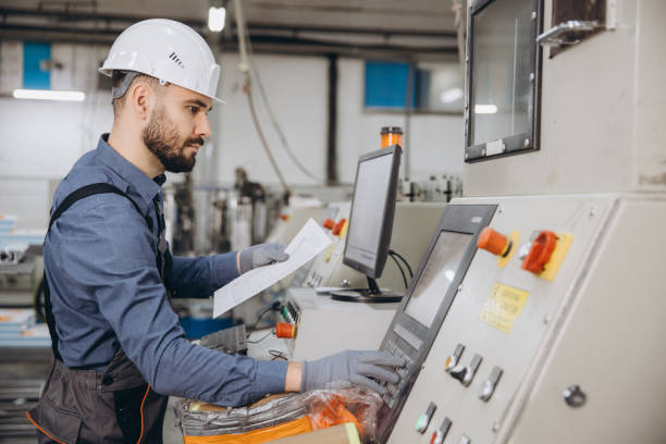 istock Factory worker operating machinery for aluminum and pvc windows and doors production 2191387546