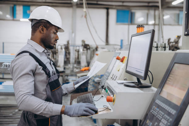 istock Factory worker operating machinery for aluminum and pvc windows and doors production 2191387552