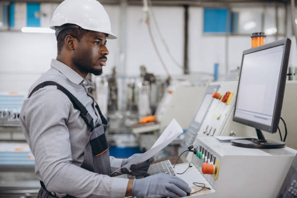 istock Factory worker operating machinery for aluminum and pvc windows and doors production 2191387575