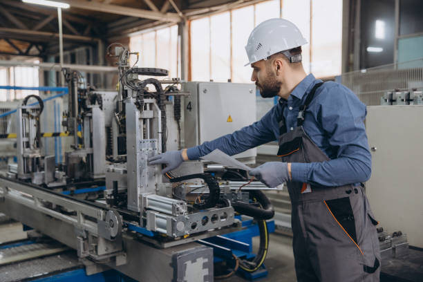 istock Factory worker operating machinery for aluminum and PVC windows and doors production 2191387622