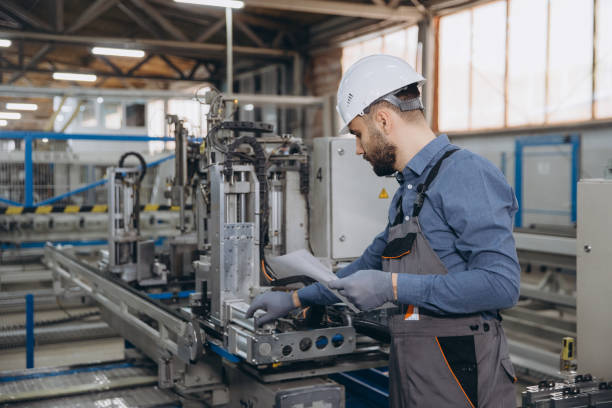 istock Factory worker operating machinery for aluminum and PVC windows and doors production 2191387660